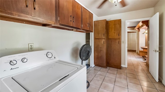 laundry room with light tile patterned floors, ceiling fan, cabinet space, and washer / dryer