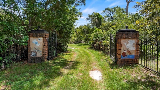 view of yard featuring a gate and fence