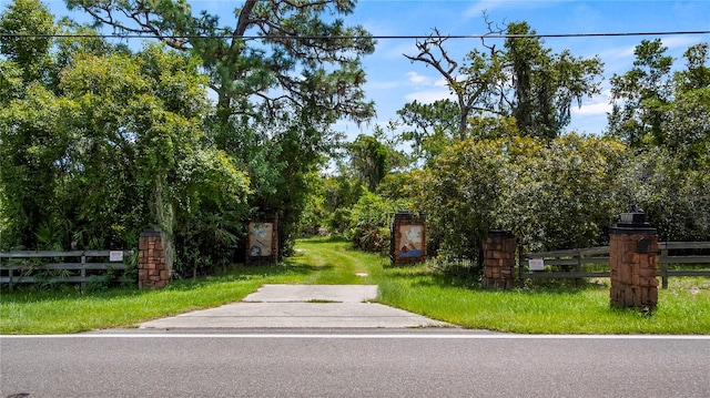 exterior space featuring fence and a yard