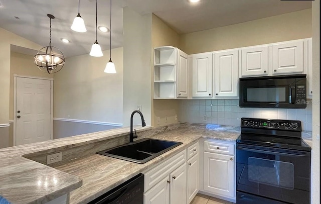 kitchen featuring decorative light fixtures, black appliances, white cabinetry, and sink