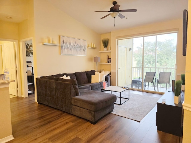 living room featuring lofted ceiling, ceiling fan, and dark hardwood / wood-style floors