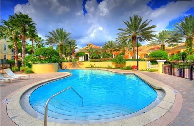 view of swimming pool featuring a patio area