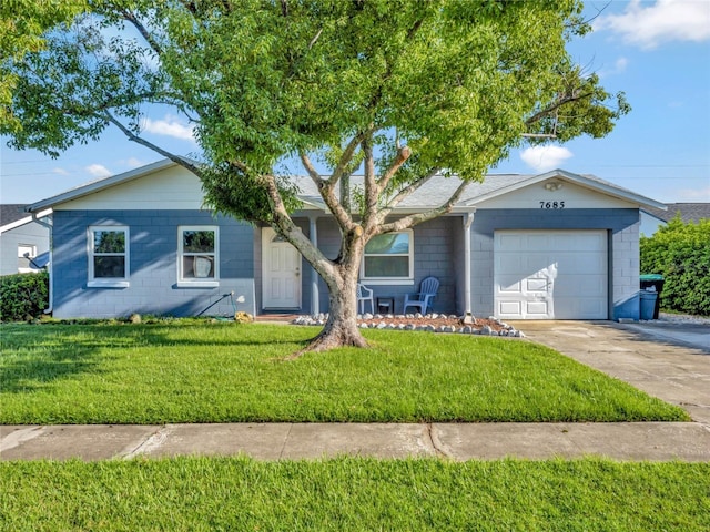 ranch-style home featuring a garage and a front yard