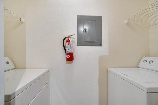 laundry area featuring washer and clothes dryer, laundry area, and electric panel