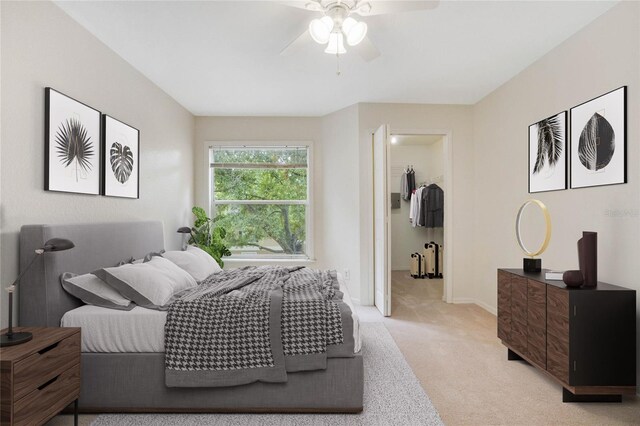bedroom featuring light carpet, a ceiling fan, and baseboards