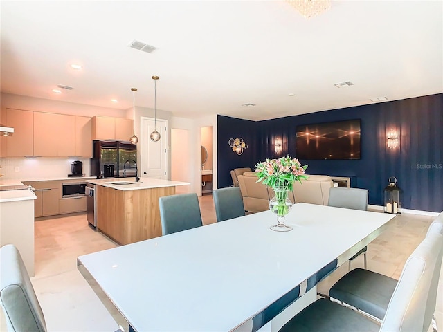 dining room featuring sink