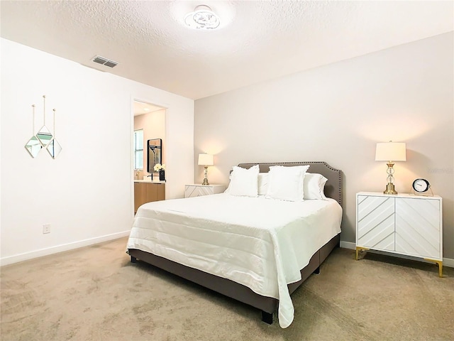 carpeted bedroom with a textured ceiling