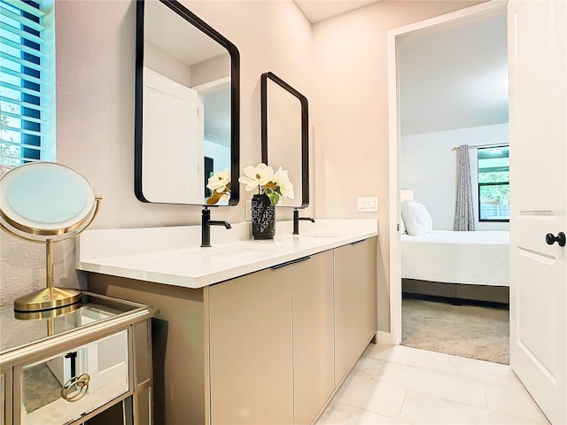 bathroom with vanity and tile patterned floors