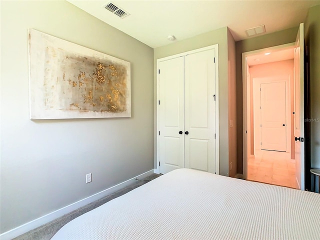 bedroom featuring a closet and carpet floors