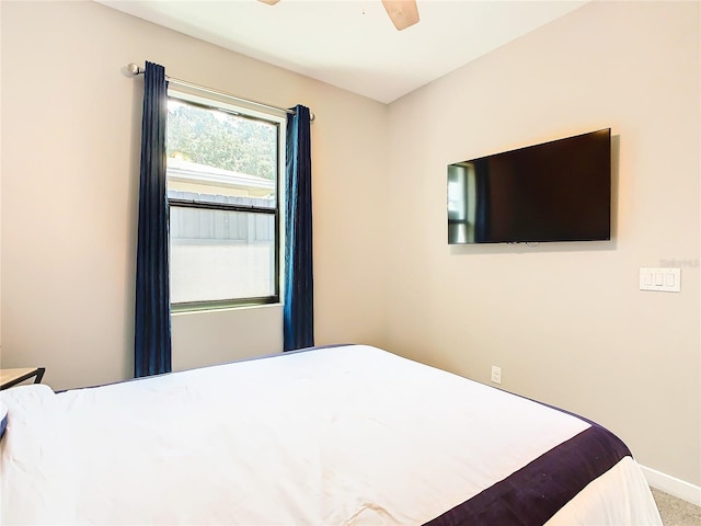 unfurnished bedroom featuring carpet floors and ceiling fan