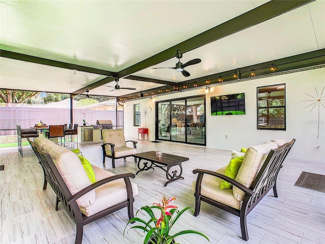 view of patio with ceiling fan, a grill, and an outdoor hangout area