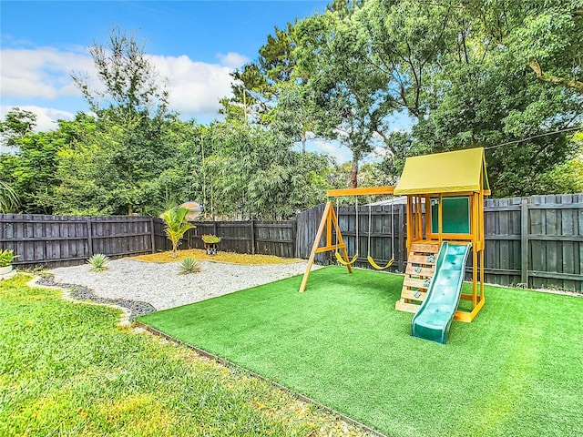 view of playground with a yard