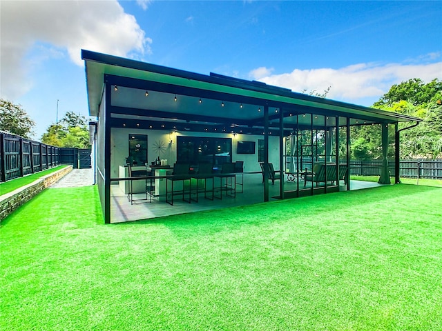 view of home's community with a patio and a yard