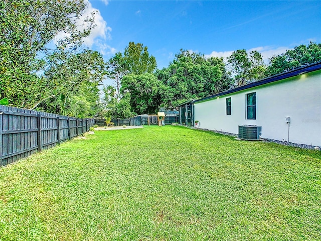 view of yard with central AC unit