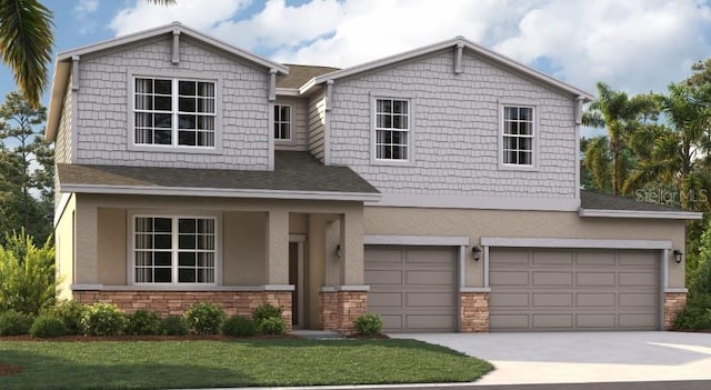 view of front facade featuring a front lawn and a garage