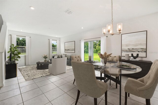 dining area featuring light tile patterned floors, a chandelier, visible vents, and recessed lighting