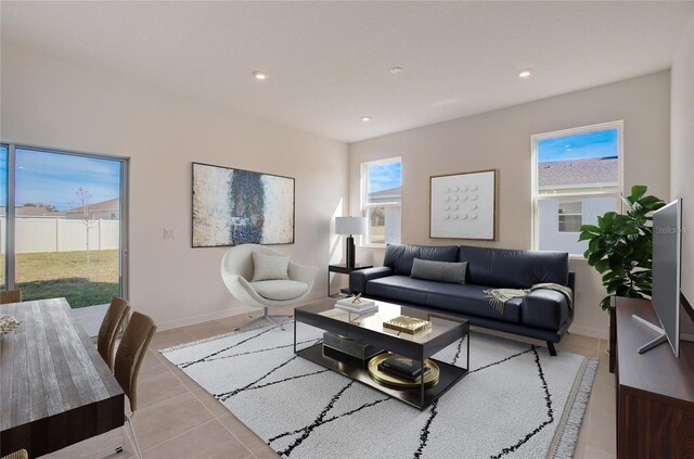 living area with baseboards, light tile patterned flooring, and recessed lighting