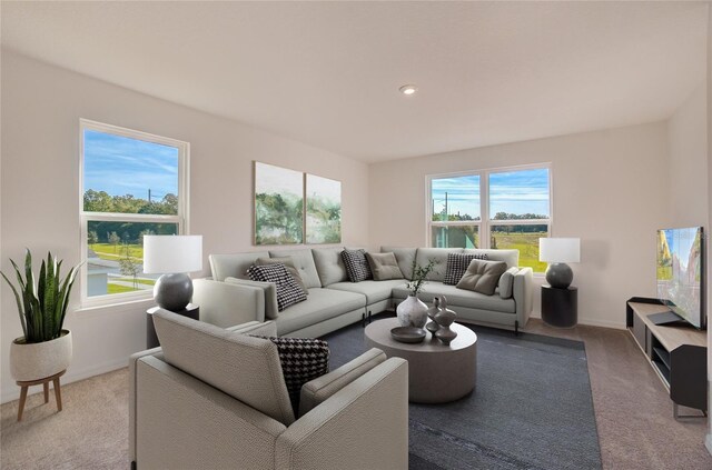 living area featuring recessed lighting, light colored carpet, and baseboards