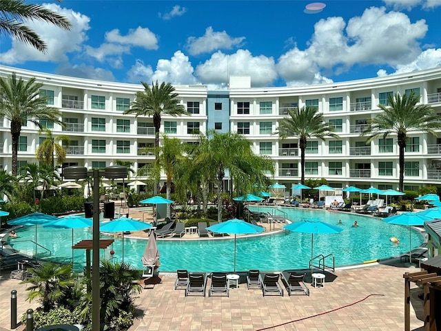 community pool featuring a patio area