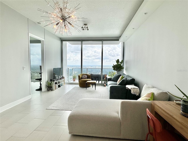 tiled living room featuring a notable chandelier, a textured ceiling, and expansive windows