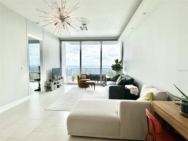 tiled living room with a textured ceiling, an inviting chandelier, and expansive windows