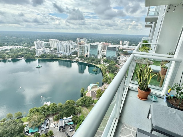 balcony featuring a water view