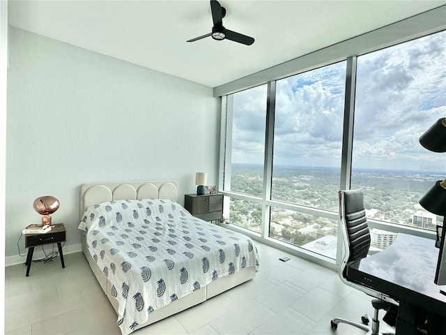 bedroom with ceiling fan and multiple windows