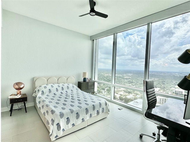 bedroom featuring ceiling fan and multiple windows