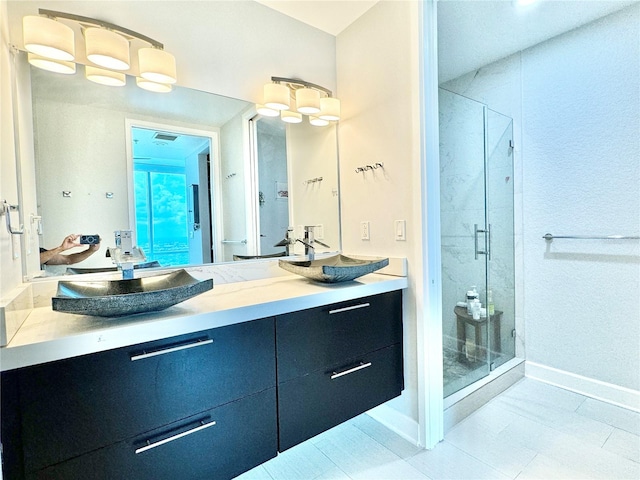 bathroom featuring tile patterned flooring, a notable chandelier, vanity, and walk in shower