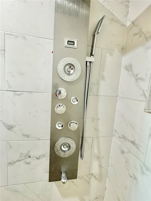 room details with a tile shower