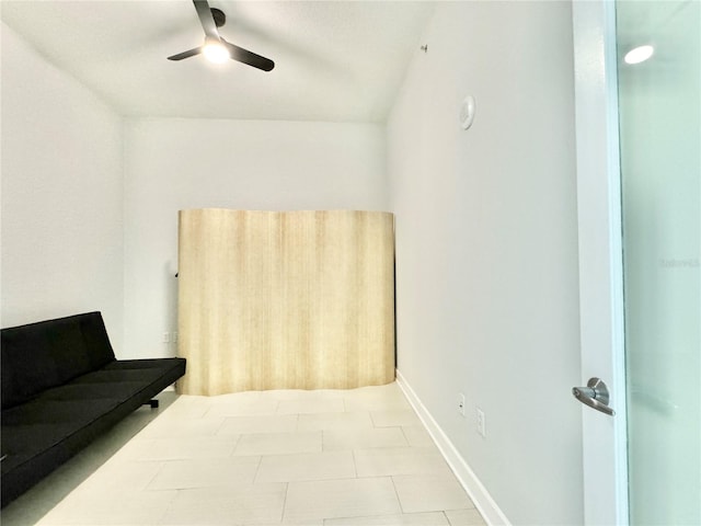 tiled bedroom with ceiling fan