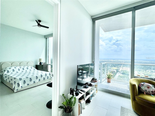 tiled bedroom with ceiling fan and floor to ceiling windows