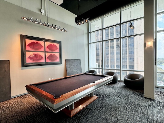 rec room featuring carpet flooring, a wall of windows, and billiards