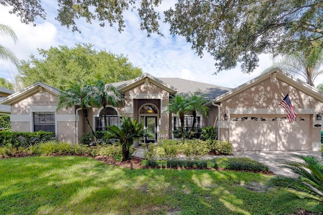 ranch-style house featuring a garage and a front lawn