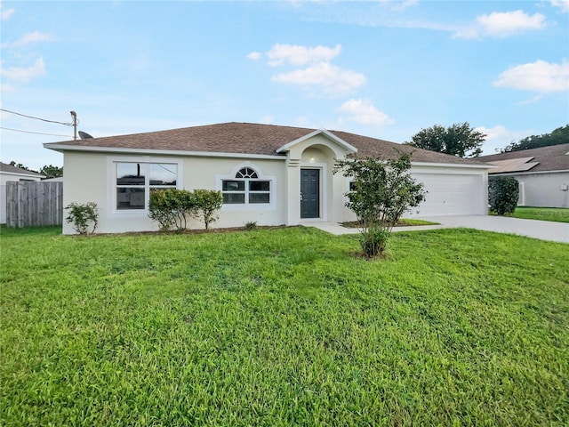 ranch-style home with a garage and a front lawn