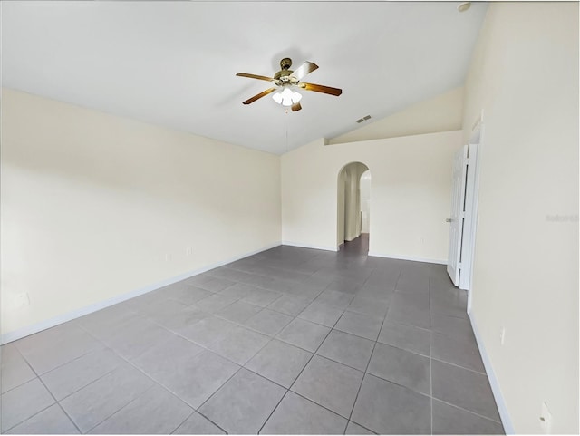 spare room featuring ceiling fan, tile patterned flooring, and lofted ceiling