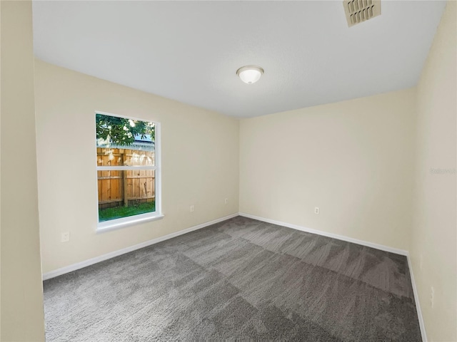 unfurnished room with carpet floors