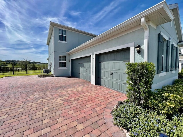 view of property exterior with central AC