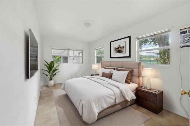 bedroom featuring light tile patterned flooring