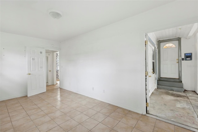 empty room featuring light tile patterned flooring