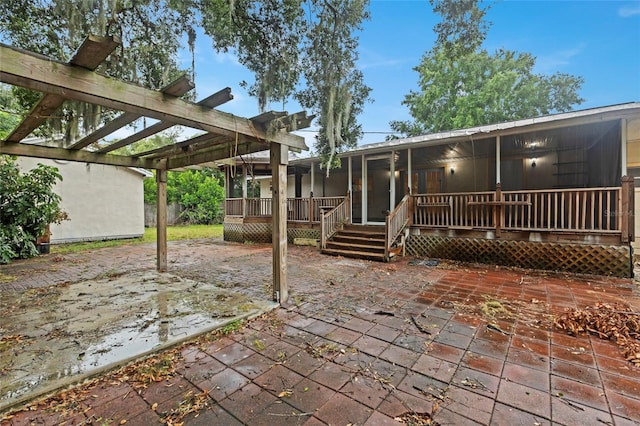 view of patio / terrace with a pergola and a deck