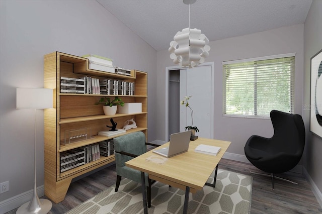 sitting room featuring lofted ceiling, dark wood-type flooring, and a textured ceiling