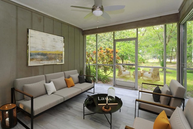 sunroom with plenty of natural light and ceiling fan