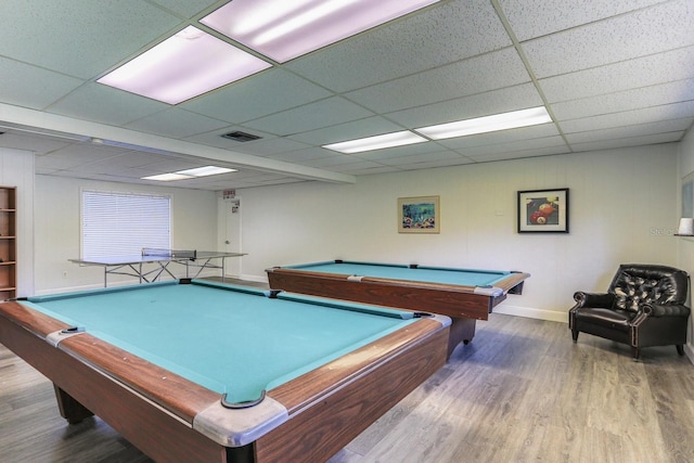 game room with pool table, hardwood / wood-style floors, and a drop ceiling