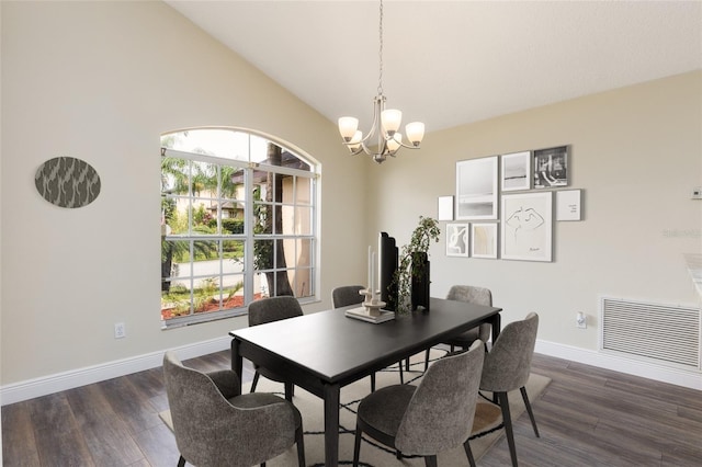 dining area featuring vaulted ceiling, an inviting chandelier, and dark wood-type flooring