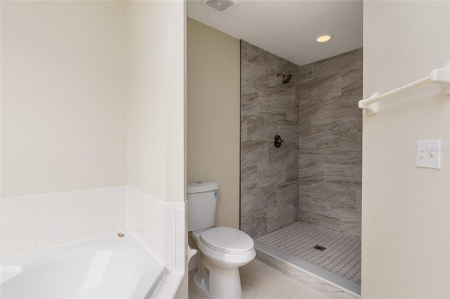 bathroom with plus walk in shower, toilet, and tile patterned floors