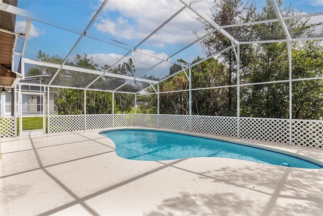 view of pool with a lanai and a patio