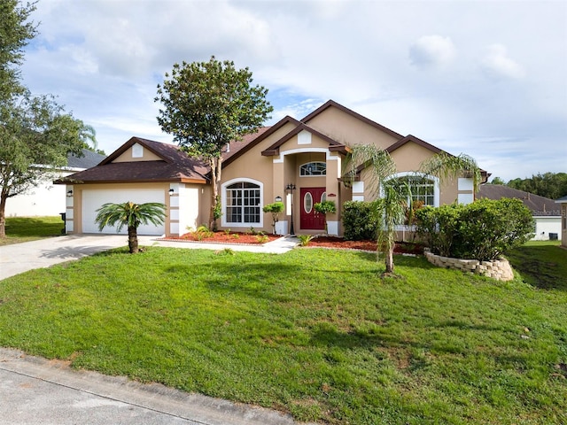 view of front of property featuring a front yard and a garage