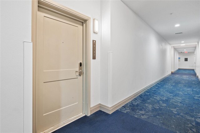 hall with carpet flooring