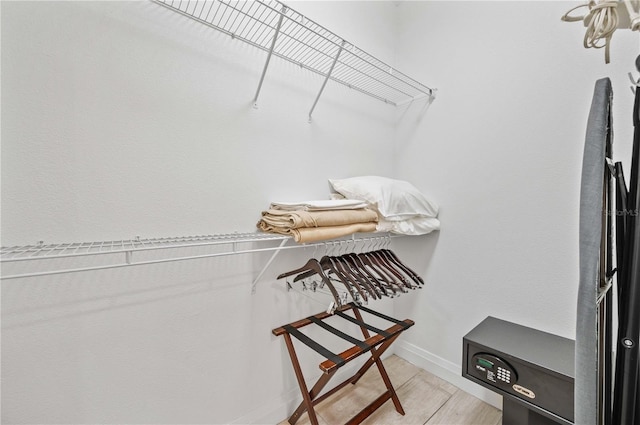 walk in closet with light wood-type flooring